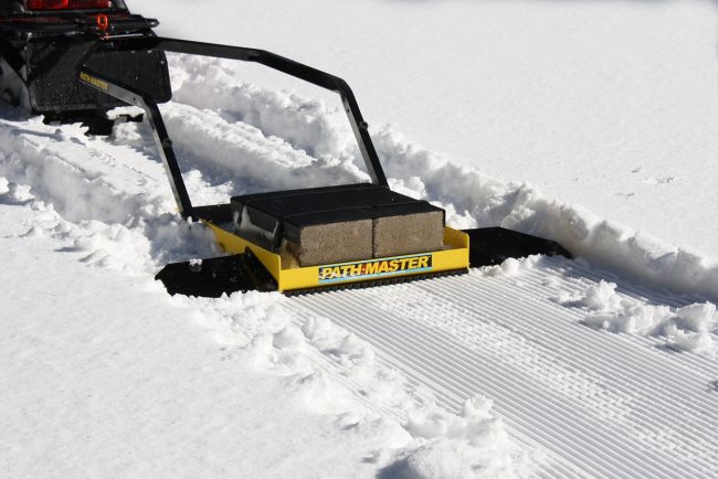 Tiny trail snow groomer.