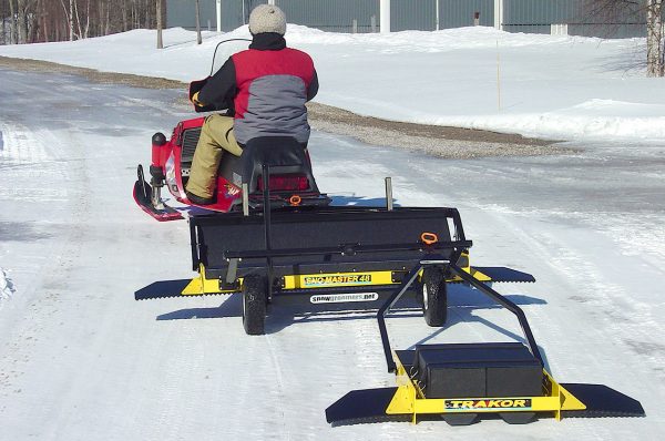 SNO-MASTER 48 with wheel kit and TRAKOR towed on a trail