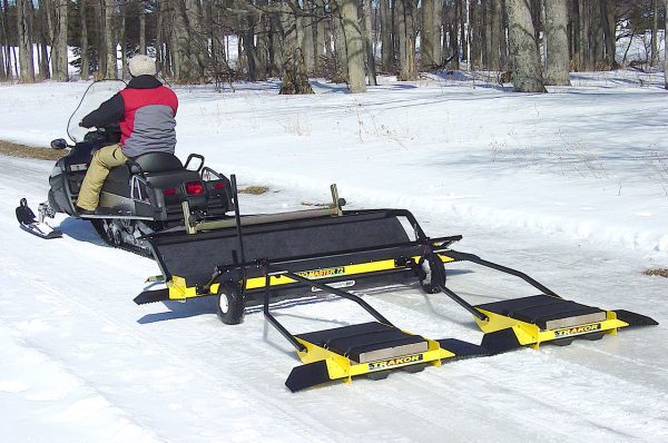 small snowmobiles can tow our snow groomers. and track setters.