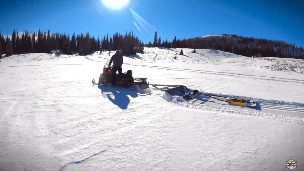 skidoo Skandic grooming in 12" new powder. Laying classic cross country ski tracks.